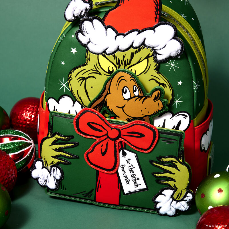 Image of our How the Grinch Stole Christmas mini backpack, showing off the appliqué of Max that rises up over the present